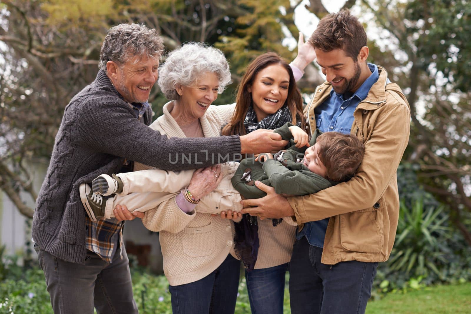 Family is a little world created by love. a happy multi-generation family having fun outdoors