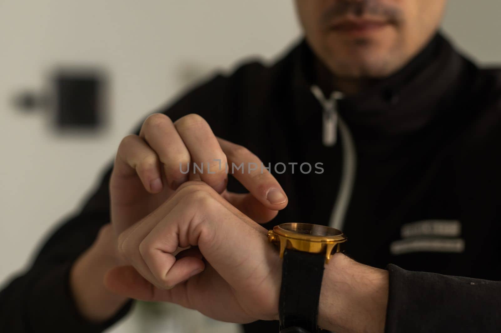 A watch on a man's hand of a man, a close-up of a man's watch on his hand.