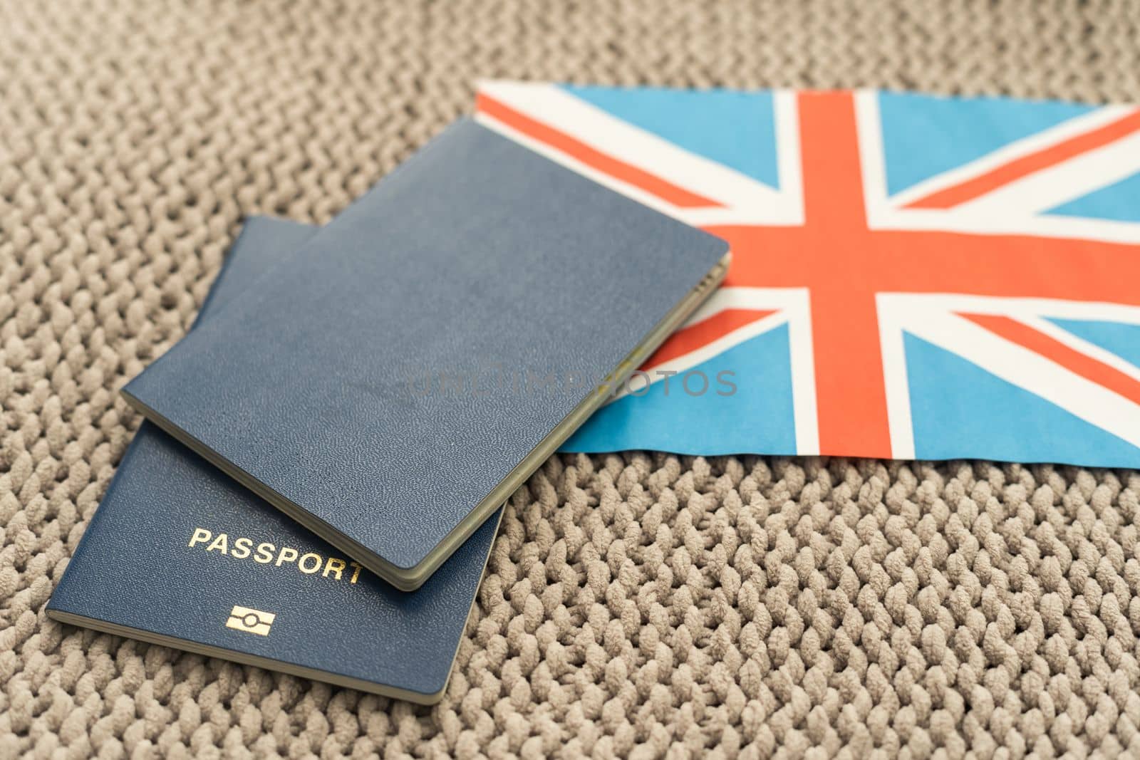 Passport and flag of Great Britain. Immigration, refugee, change of citizenship, refuge, residence, brexit European Union concept. Travel, recieving visa and tourism idea by Andelov13