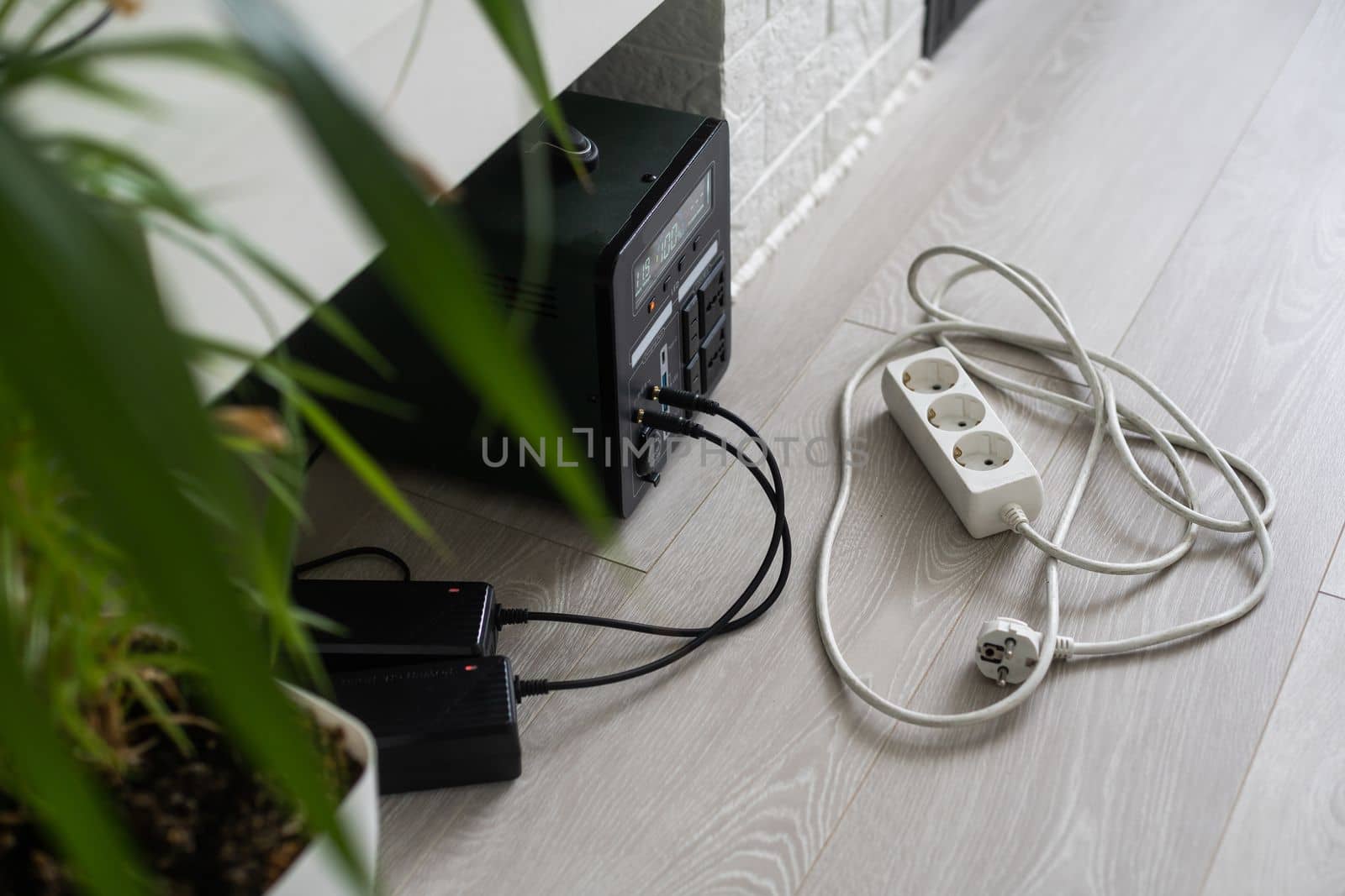 Charging station for gadgets when there is no light during blackout. Generator power bank battery in the absence of electricity. Charge electric rechargeable battery by Andelov13