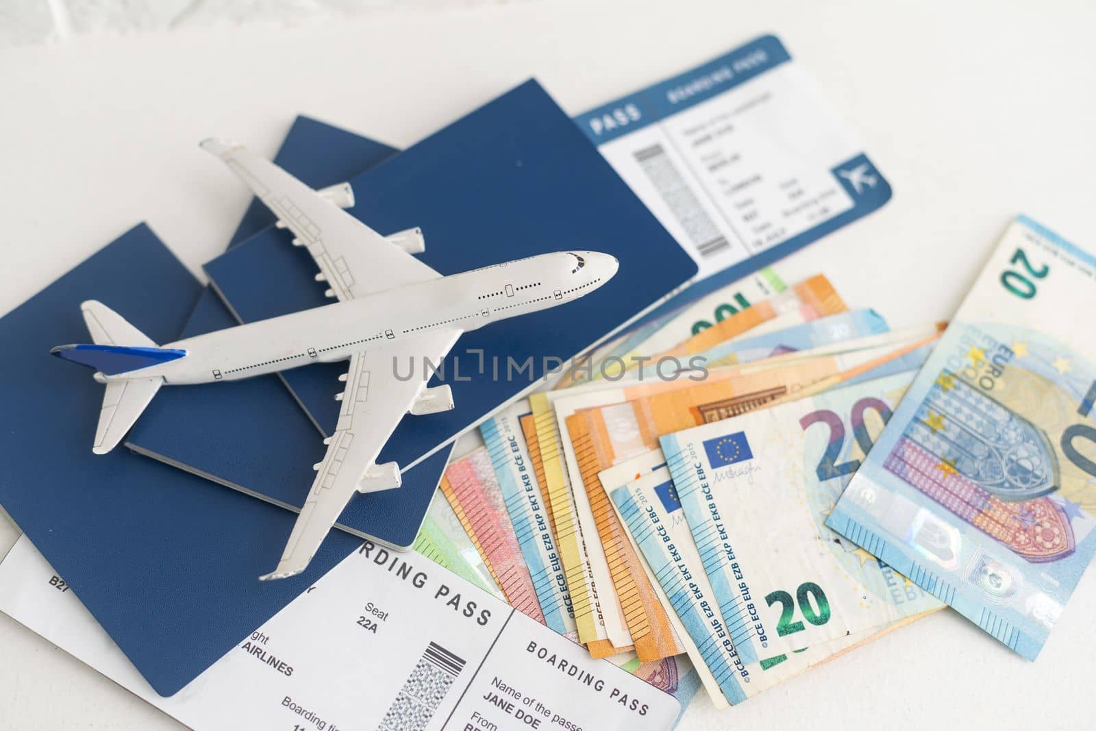 Airline tickets and documents on white background.