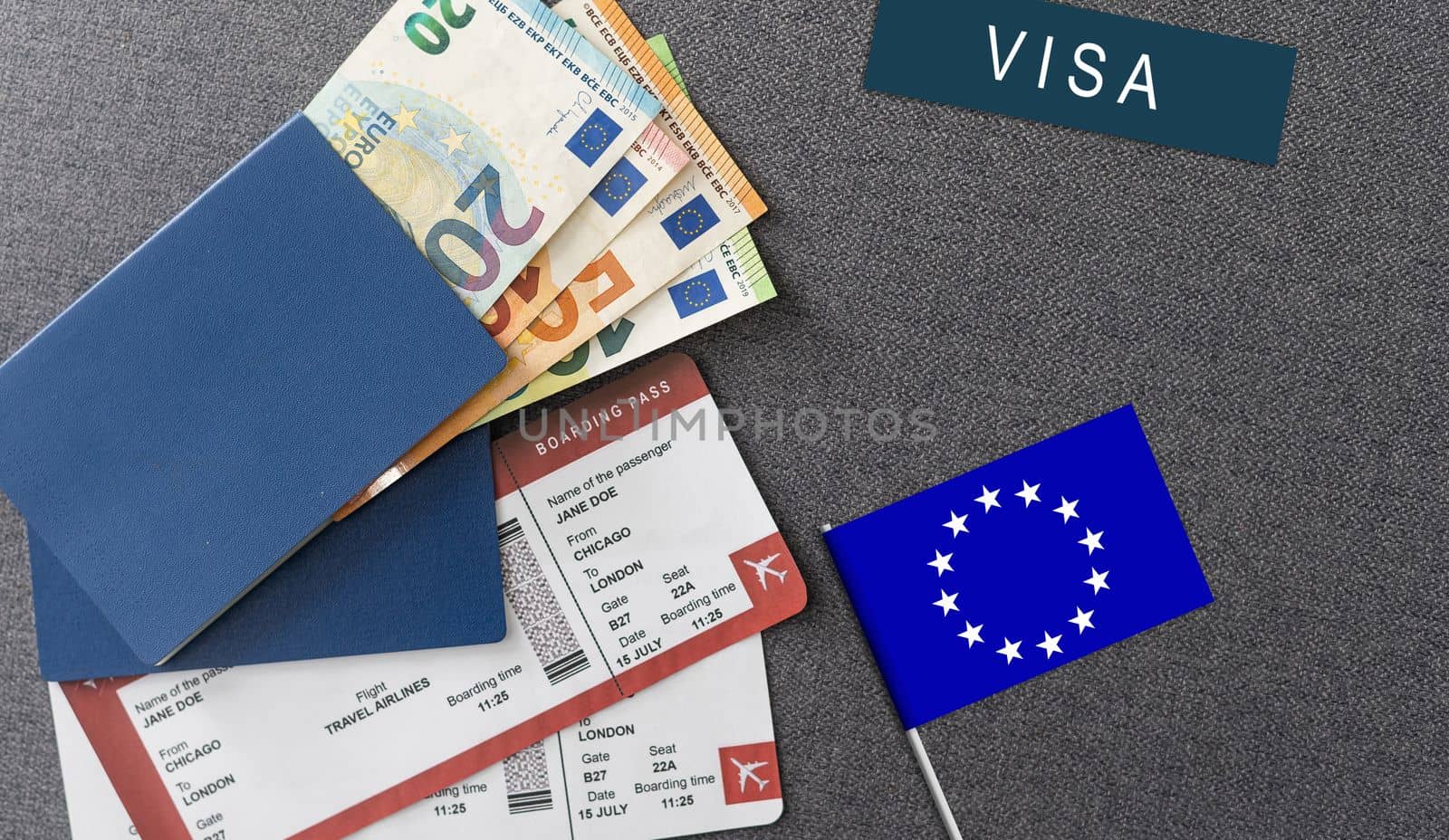 Flag of European Union with passport and toy airplane on wooden background. Flight travel concept by Andelov13