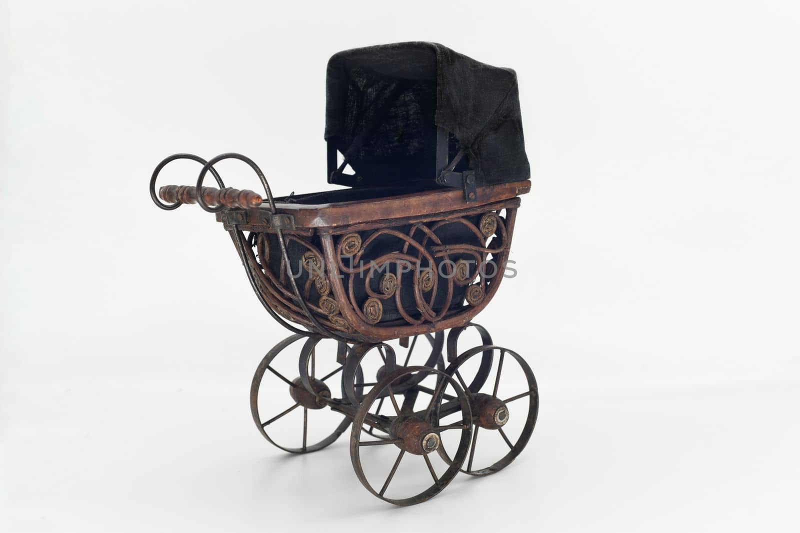 Vintage wooden stroller isolated on white background