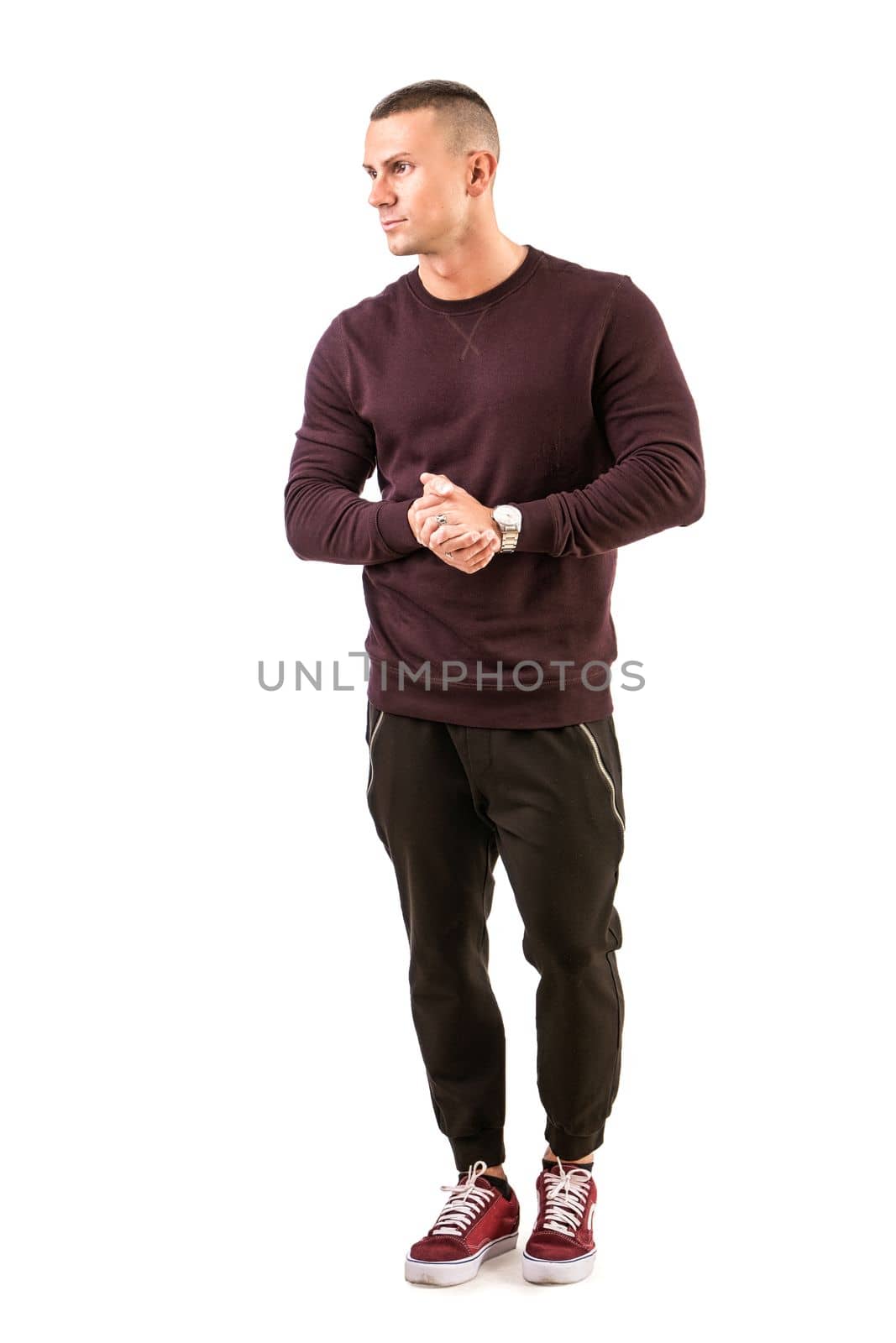 Handsome young man standing with dark shirt, full length body shot, isolated