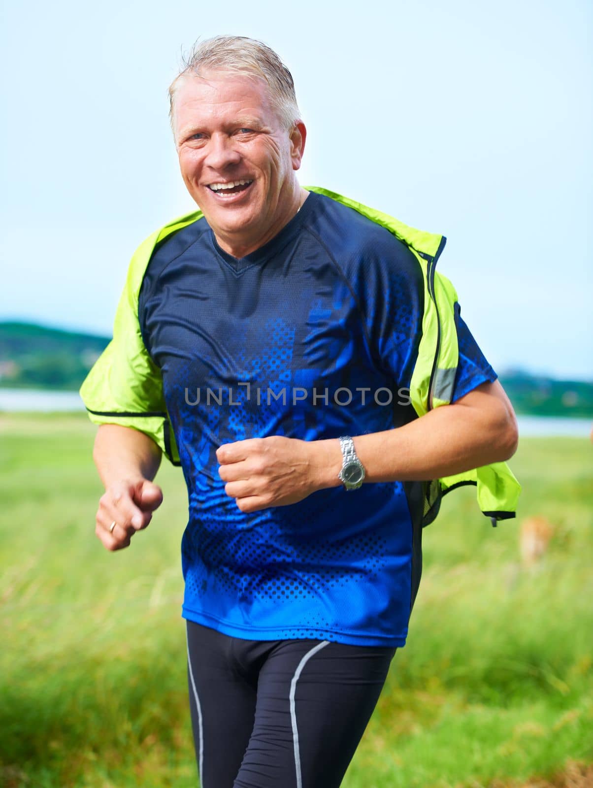 Us seniors need to keep in shape. Portrait of a senior man running outdoors. by YuriArcurs