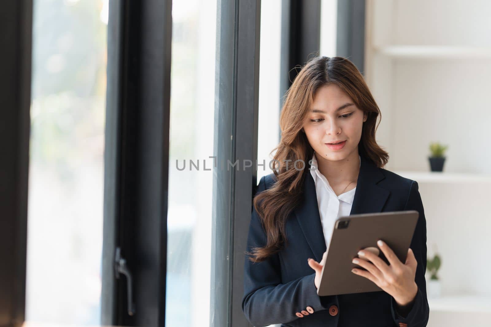 Smart business people working together with financial data in the digital tablet at co working space. finance and account concept