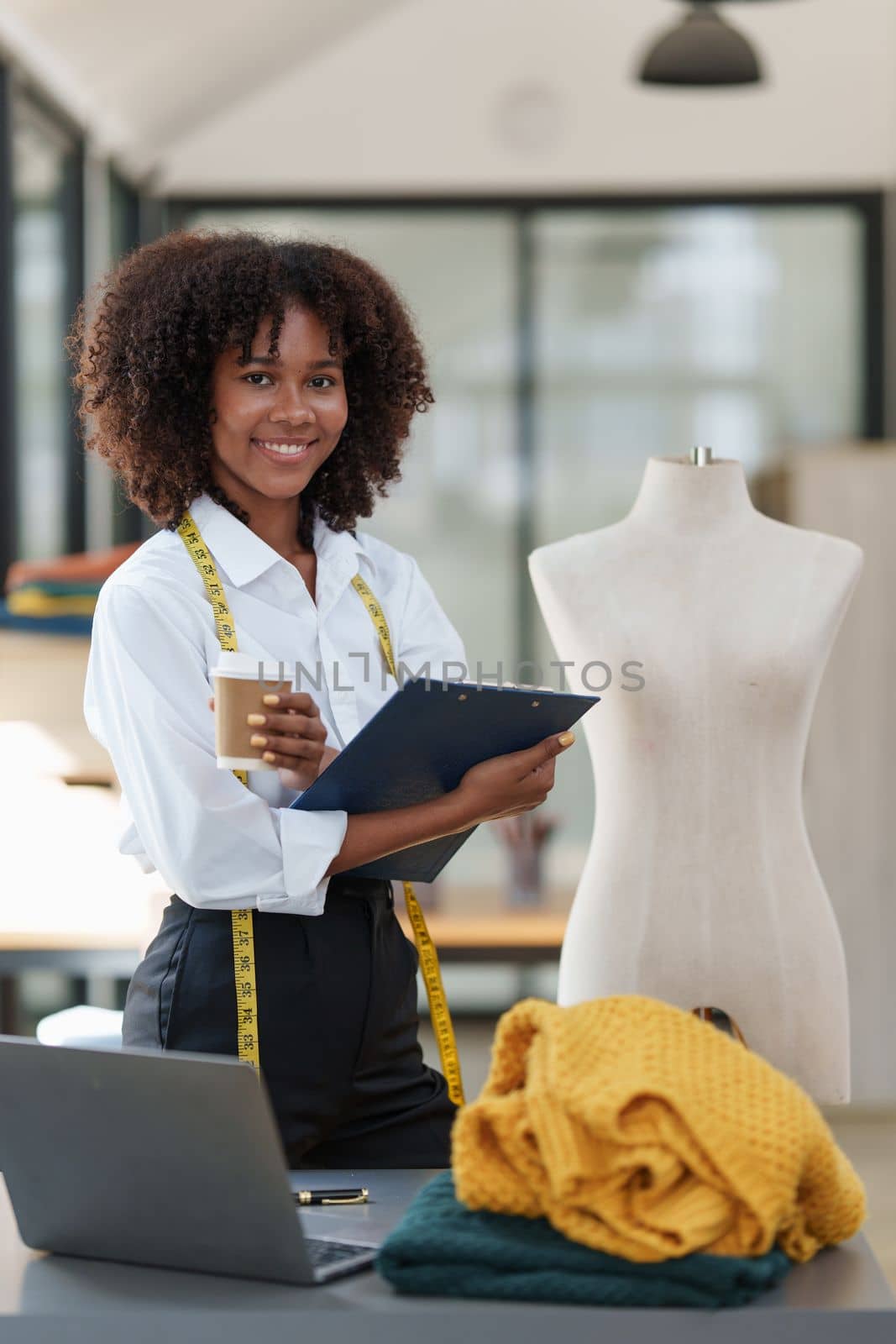 Portrait of young african american woman fashion designer stylish working at fashion studio