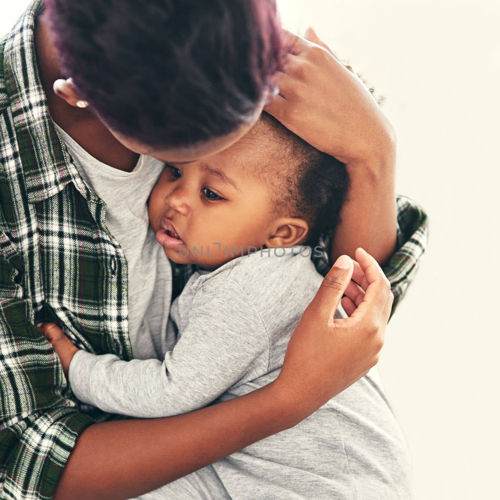 I hold my whole world in my arms. a young mother cradling her baby boy