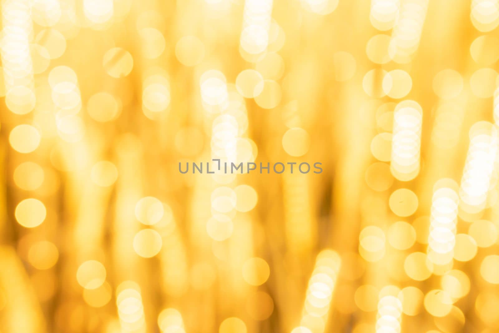 Abstract yellow light twinkled bright background with bokeh defocused lights