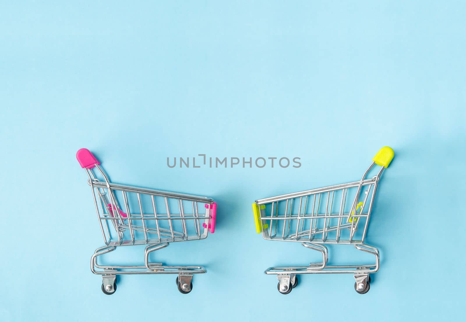 Empty Shopping Cart on a isolated blue backgroundw with copy space.