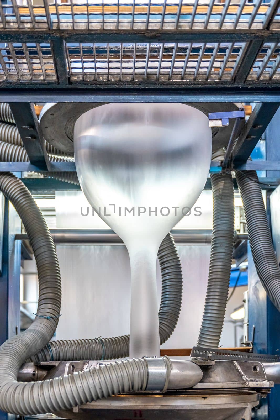 blowing plastic on a machine into a roll for the production of plastic bags.