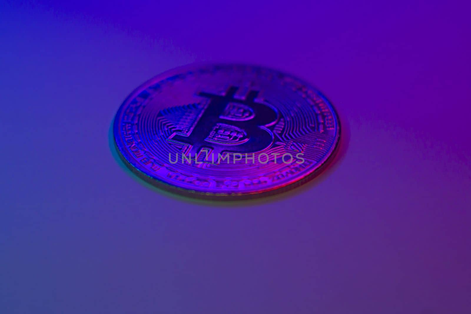 Crypto currency blue coin with bitcoin symbol on isolated on black background. Bitcoin Coin on colored background. Bitcoin cryptocurrency. Cryptocurrency Coin Concept. by mr-tigga