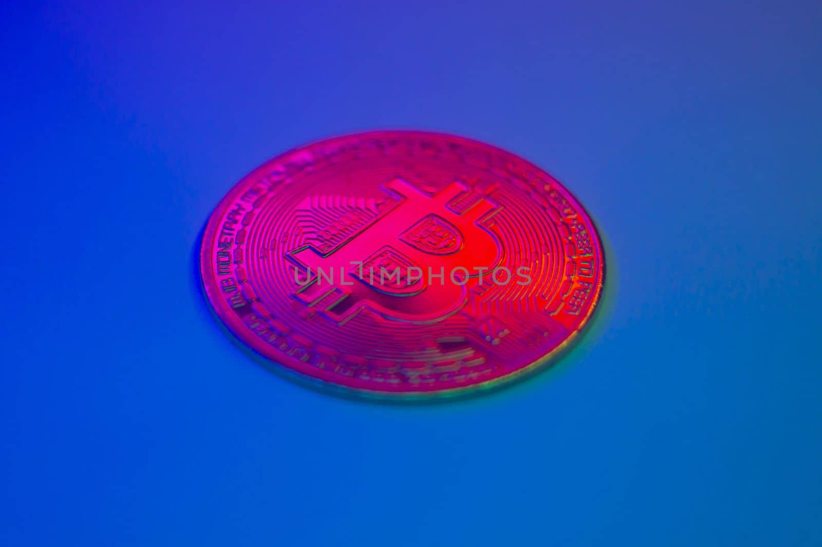 Crypto currency red coin with bitcoin symbol on isolated on black background. Bitcoin Coin on colored background. Bitcoin cryptocurrency. Cryptocurrency Coin Concept. single golden valuable