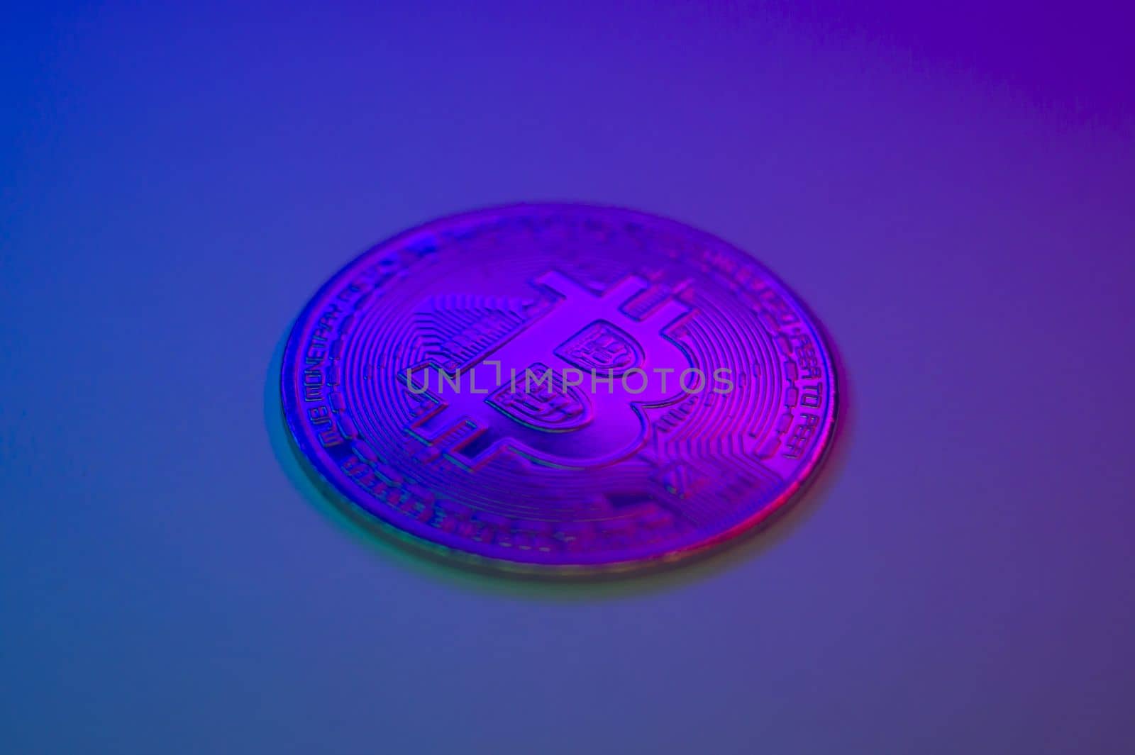 Crypto currency golden-pink coin with bitcoin symbol on isolated on black background. Bitcoin Coin on colored background. Bitcoin cryptocurrency. Cryptocurrency Coin Concept. single golden valuable