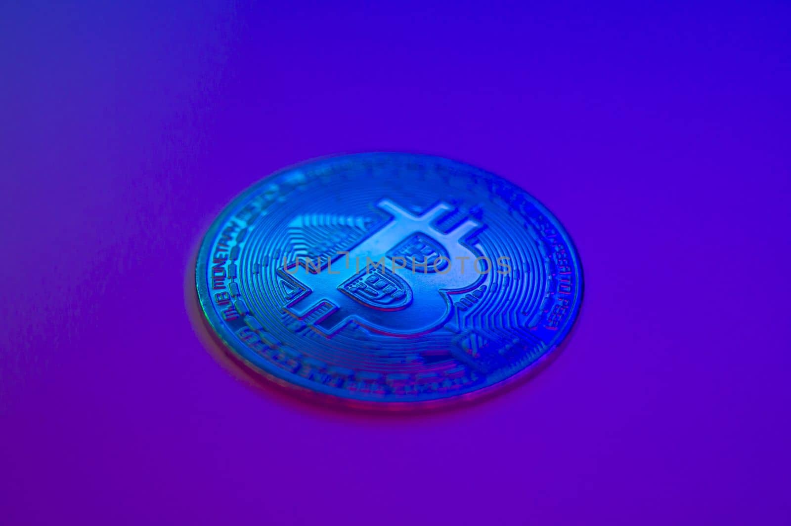 Crypto currency blue coin with bitcoin symbol on isolated on black background. Bitcoin Coin on colored background. Bitcoin cryptocurrency. Cryptocurrency Coin Concept. single golden valuable