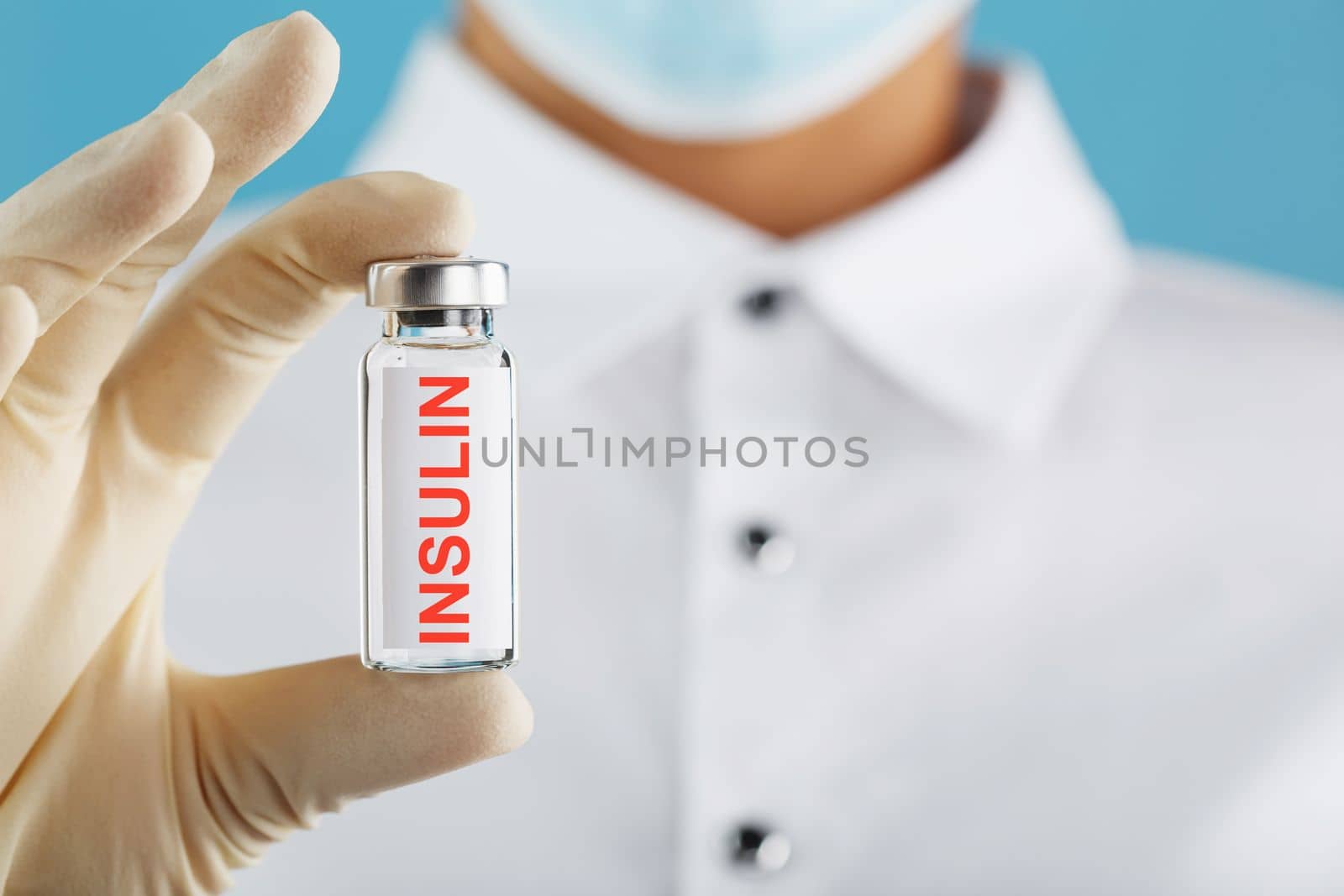 An ampoule of insulin for the treatment of diabetes in the doctor's hand close-up