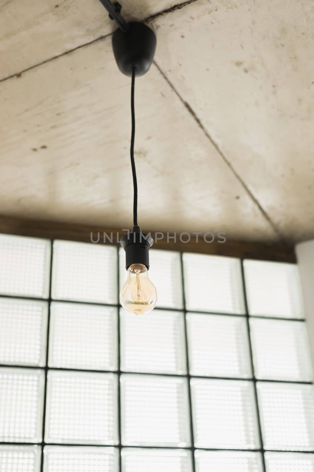 vintage light bulb hanging from ceiling in living room by Satura86