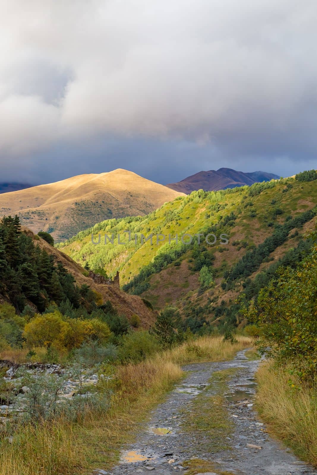 Highlands of North Ossetia. Mountains of the Caucasus. High mountains in the rays of the setting sun
