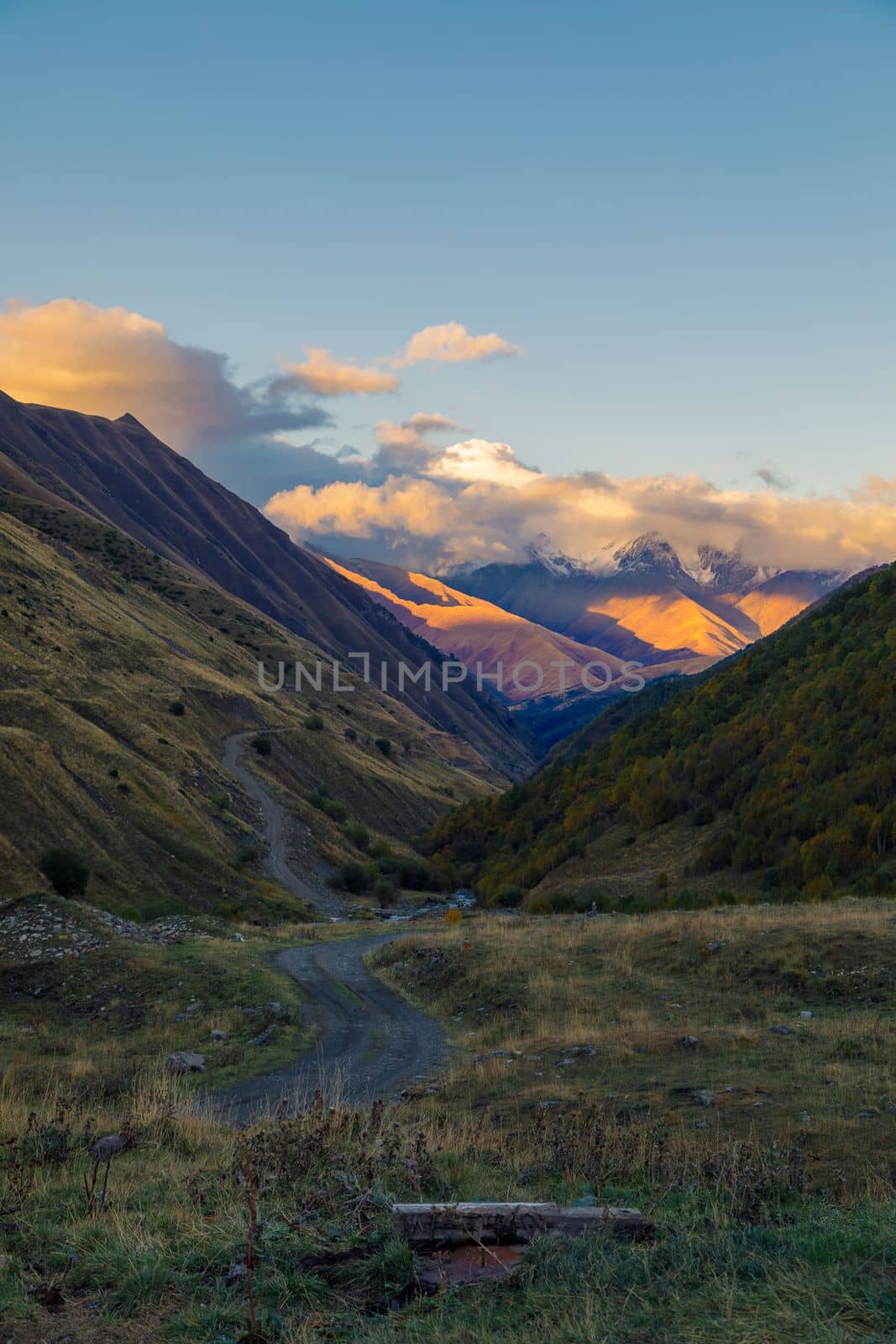 Highlands of North Ossetia. Mountains of the Caucasus. High mountains in the rays of the setting sun