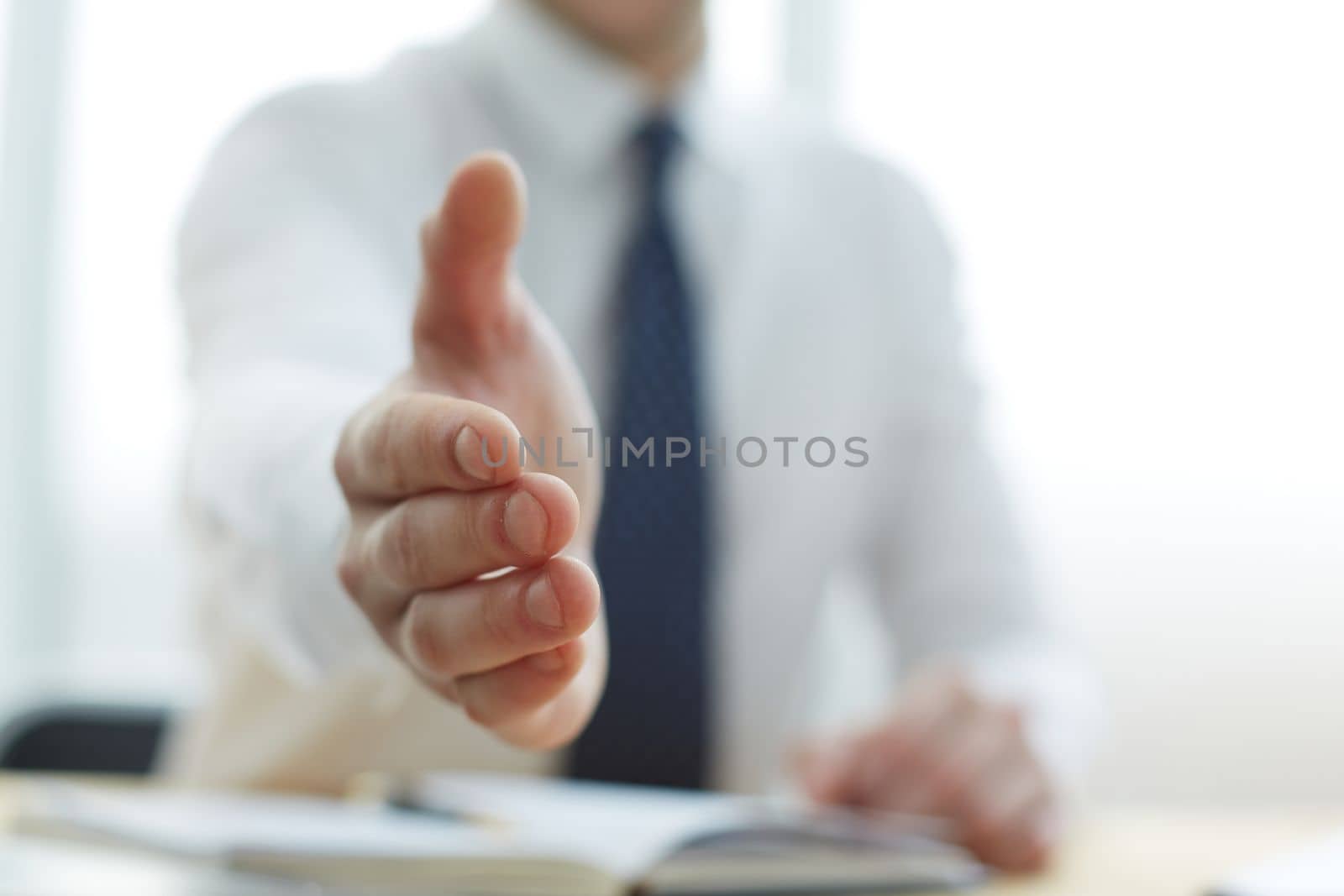 Smiling businessman pleased to meet you at office