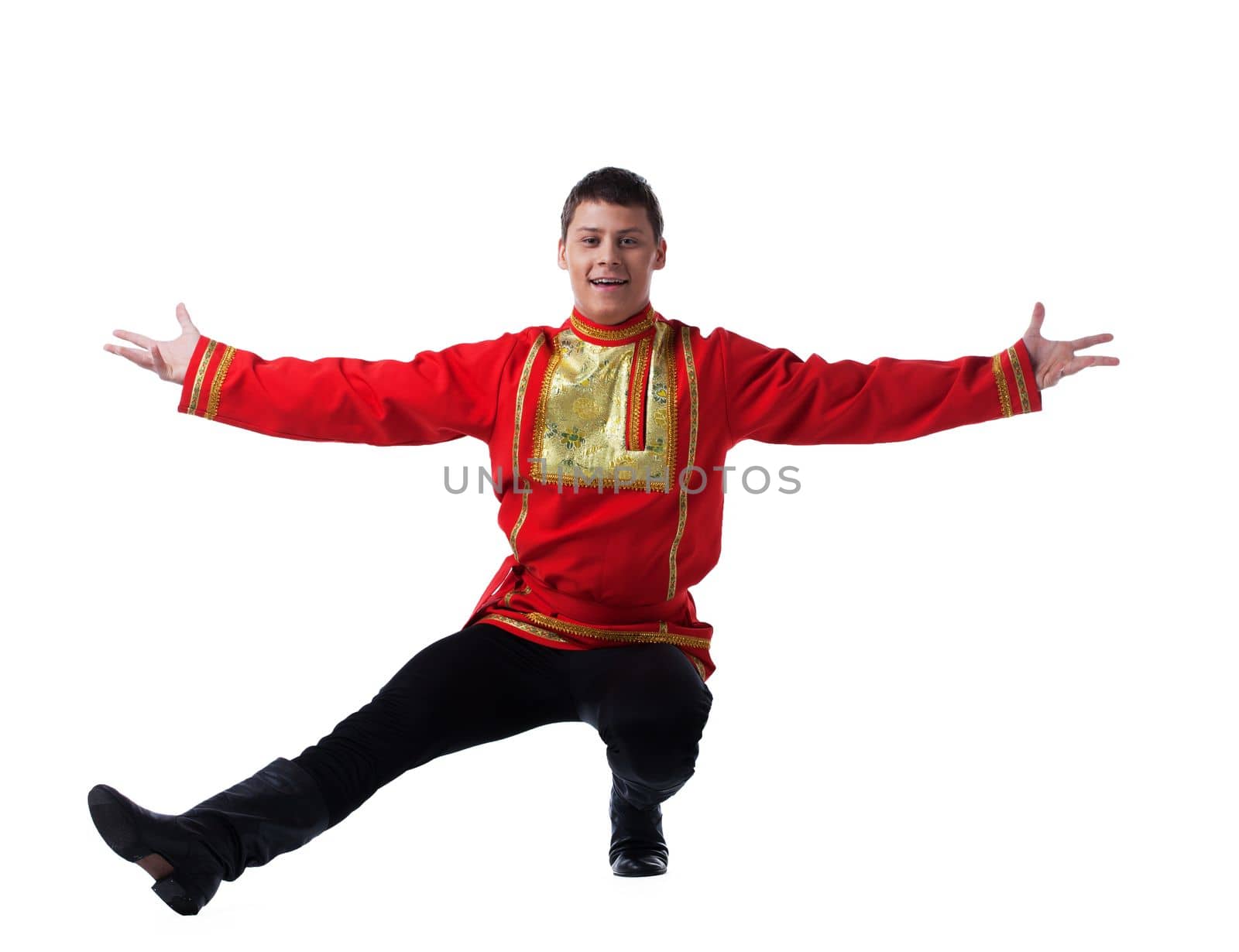 Full length portrait of man in russian costume performing dance. Isolated on white