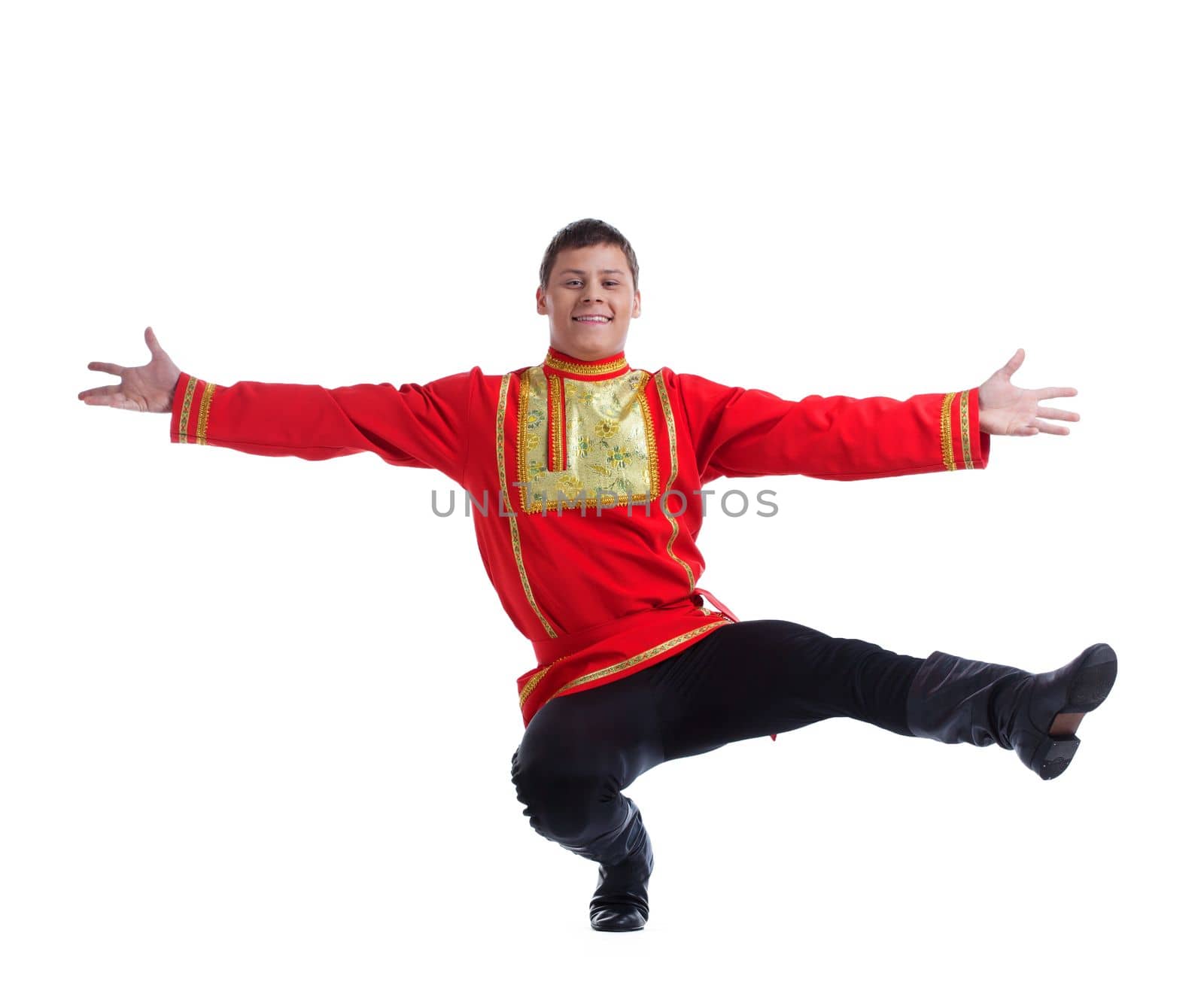 Full length portrait of happy man in russian costume performing dance. Isolated on white