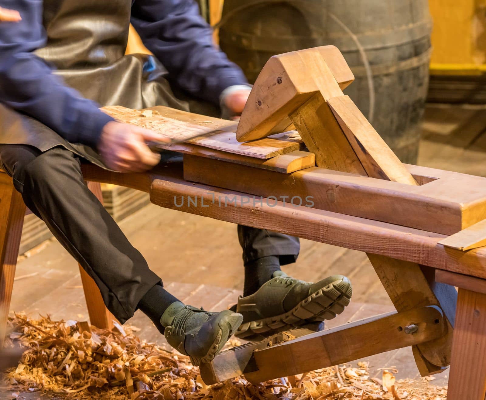 Traditional shaving horse clamp for cooper making a section of barrel