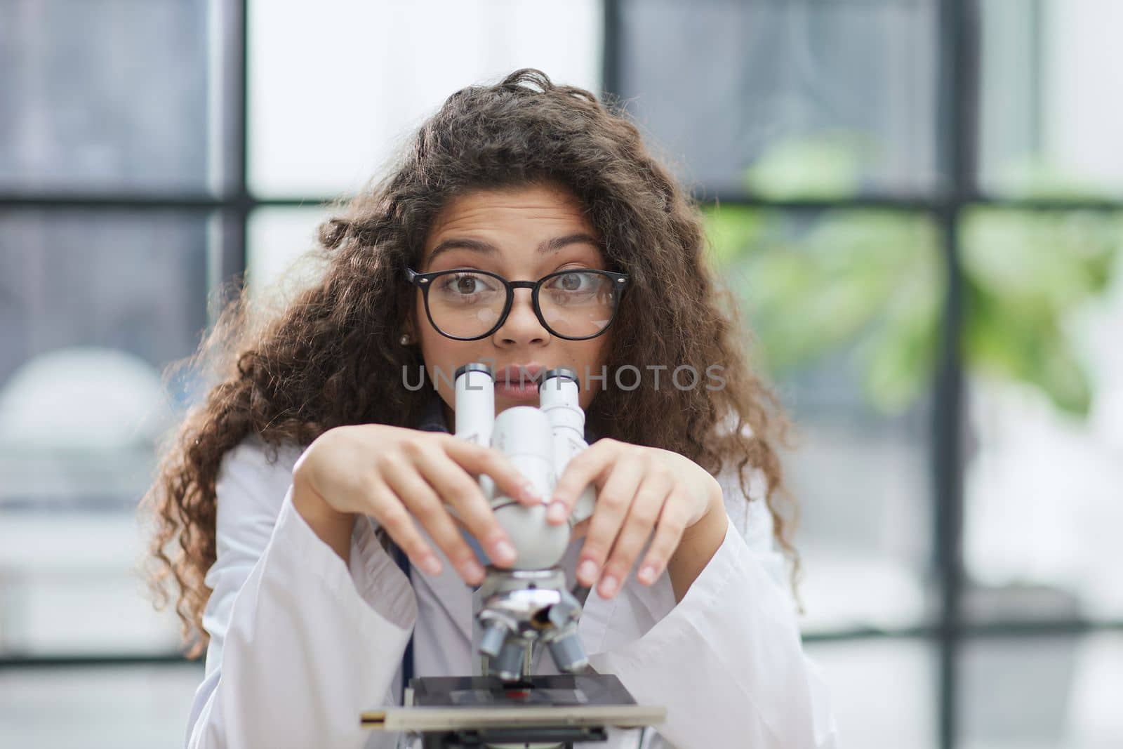 Female scientist researcher conducting an experiment in a labora