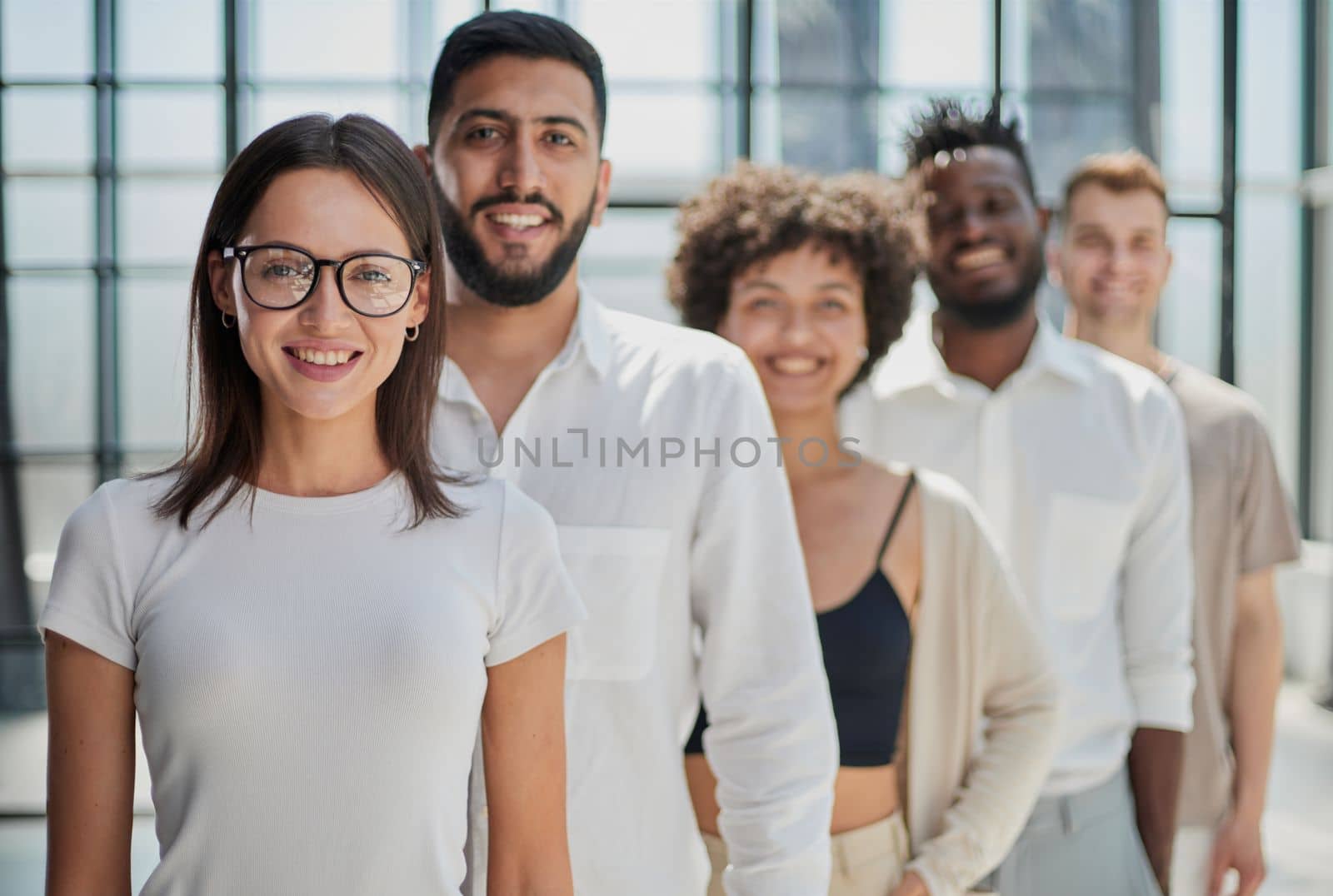 Face of beautiful woman on the background of business people