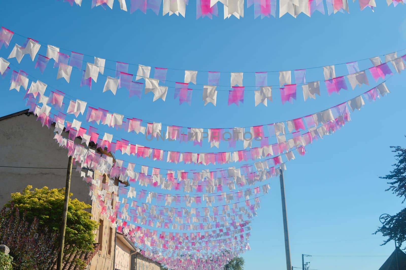 small flags stretched on a rope on a sky background