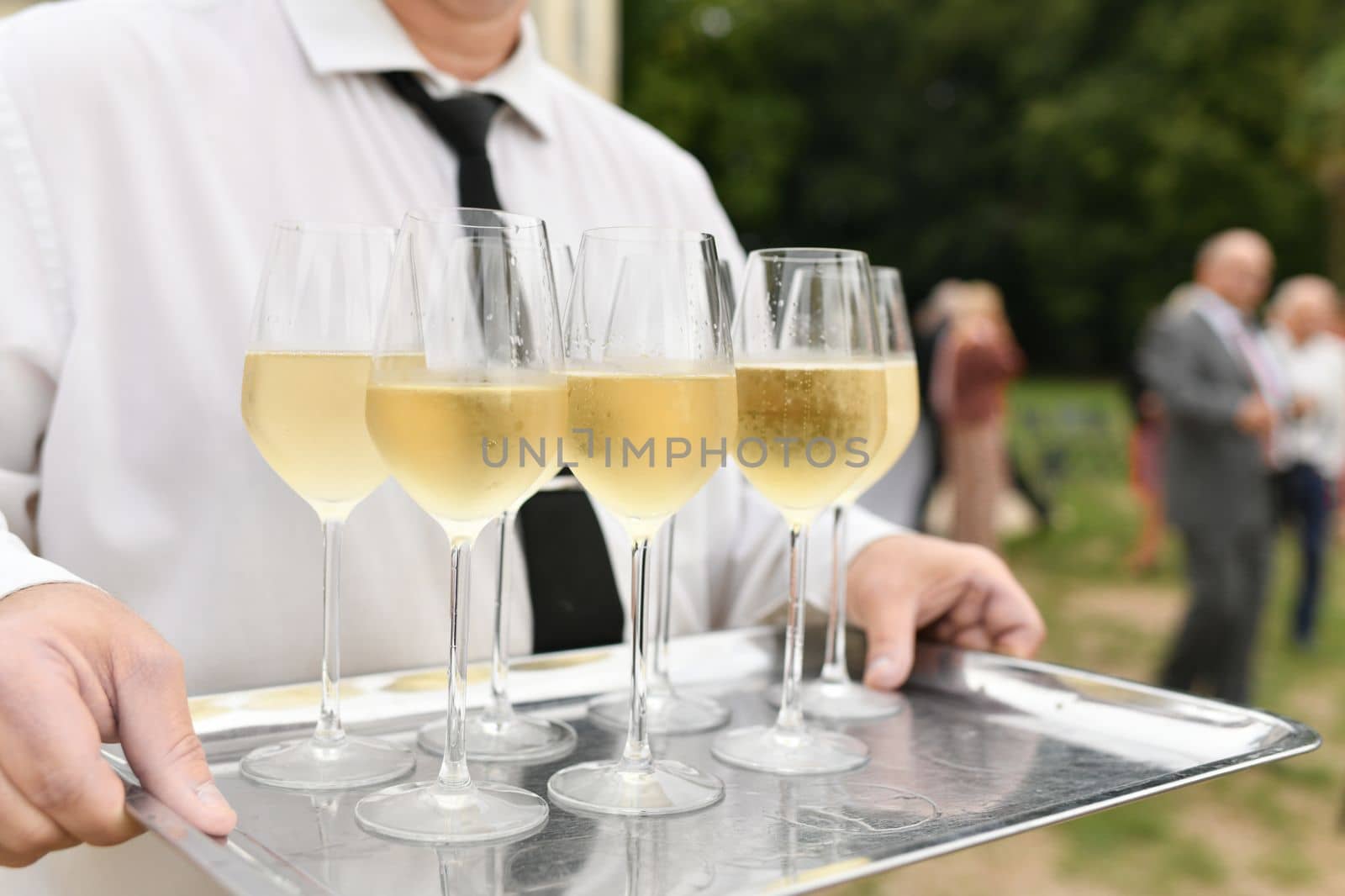 Waiter serving champagne at a wedding