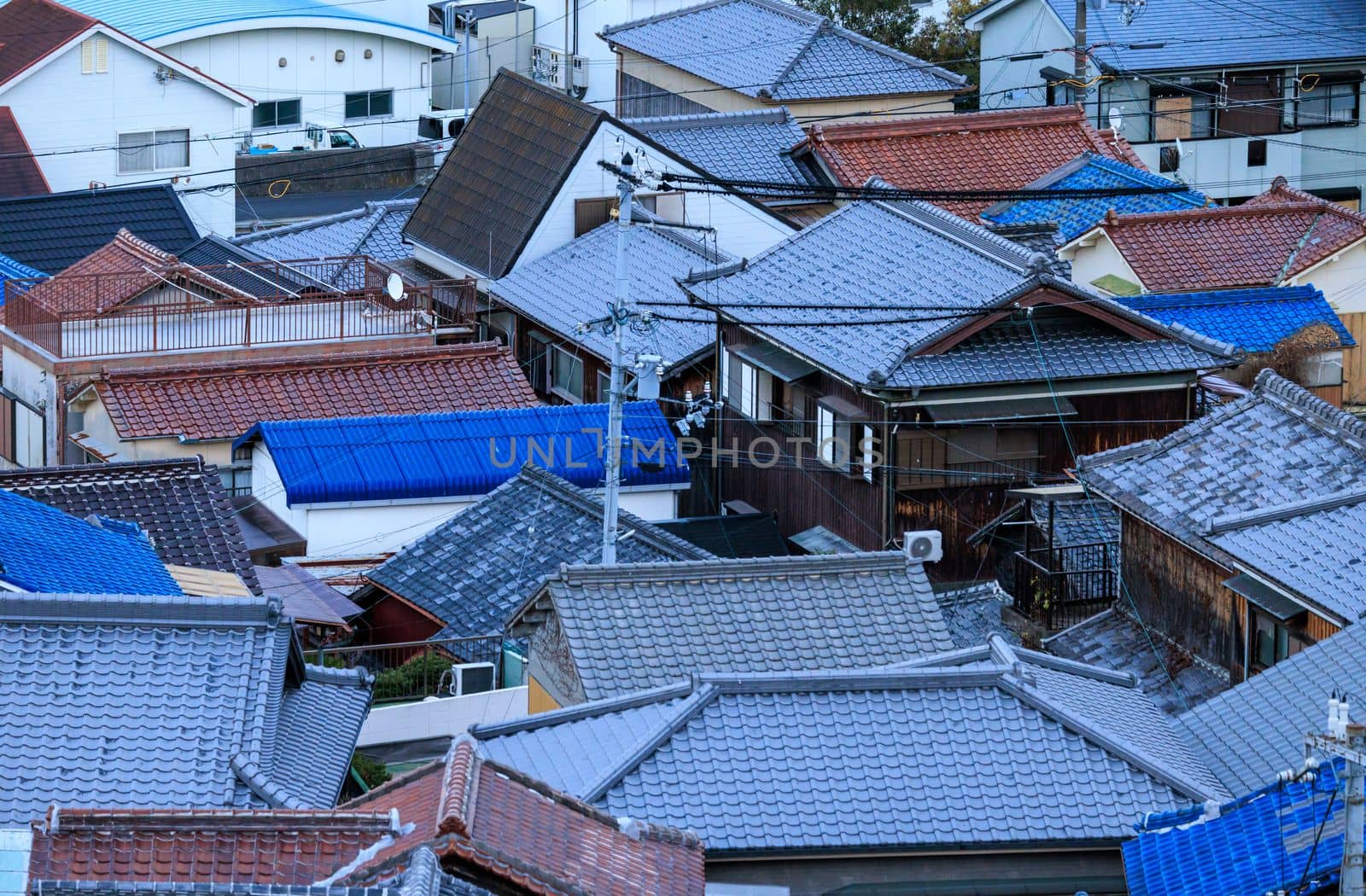 Tiled Roofs on Houses of Dense Residential Neighborhood in Japanese Town. High quality photo