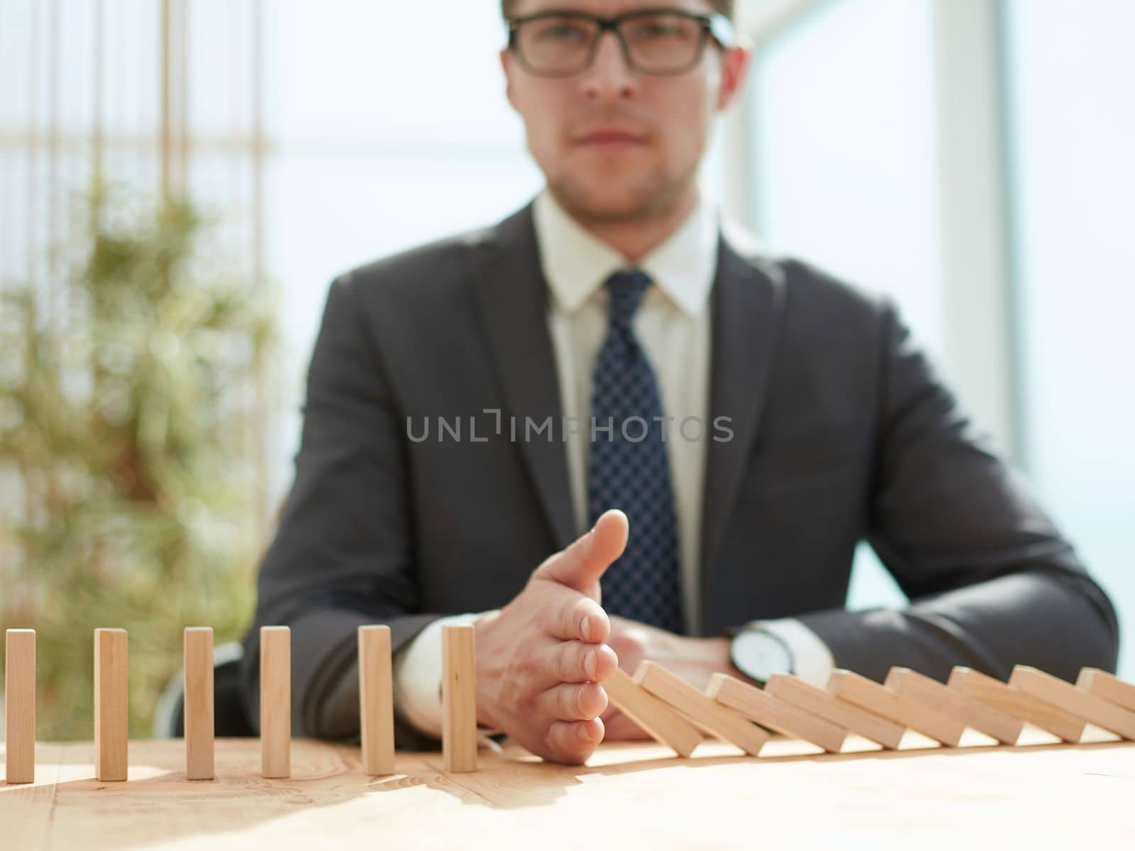 Businessman with dominoes in the office