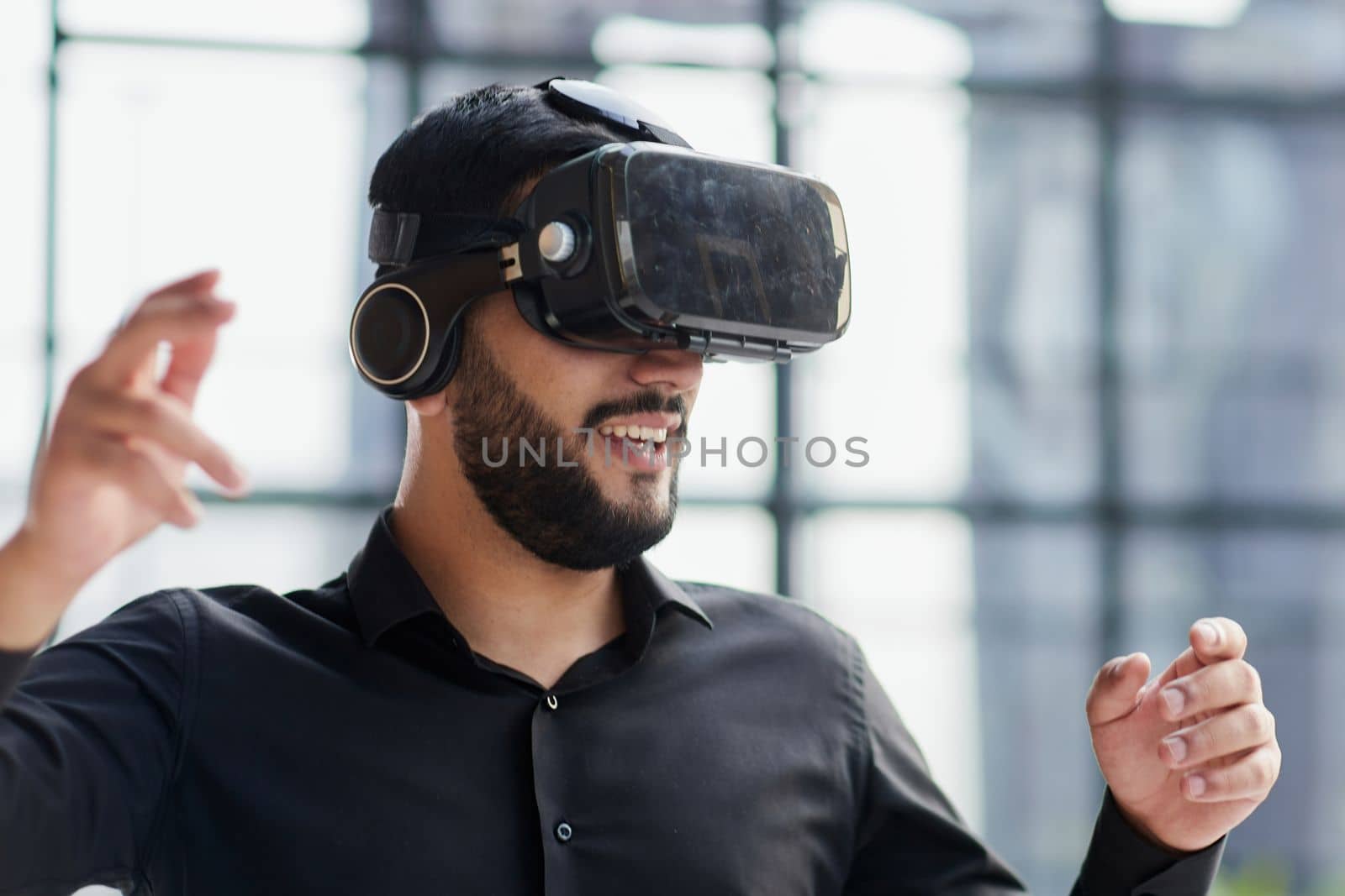 Businessman with virtual reality headset at office