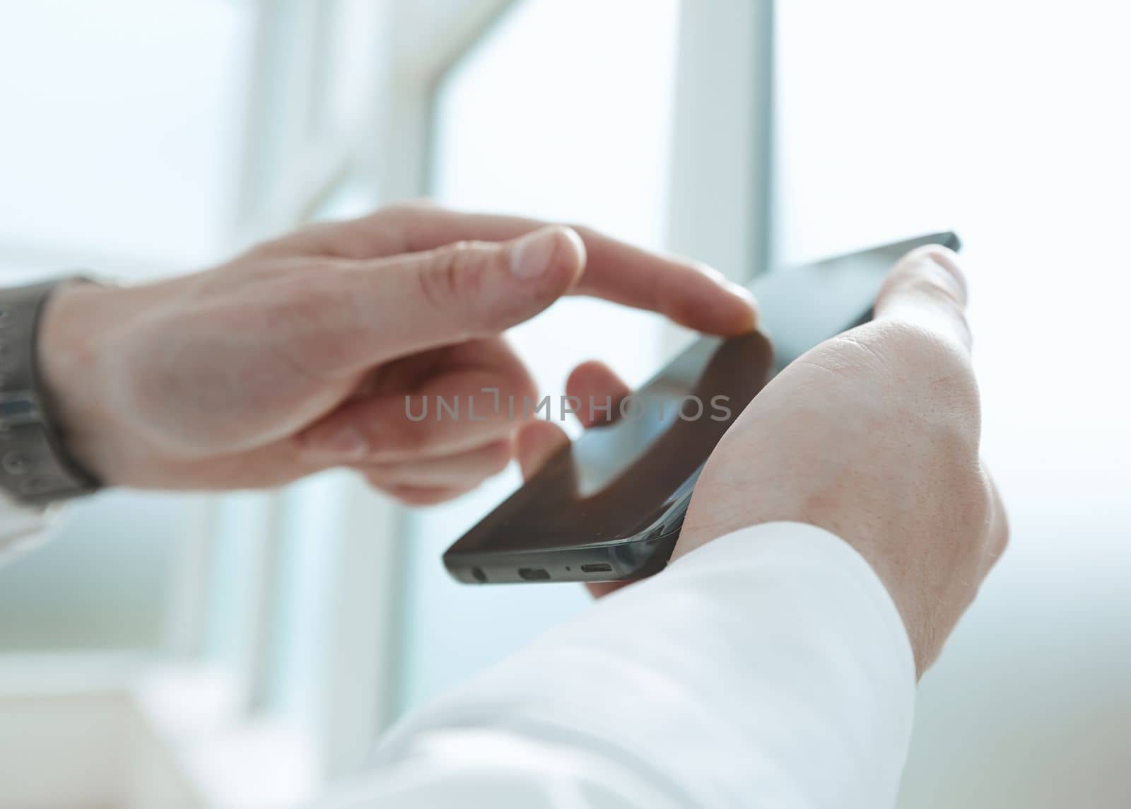 Businessman using phone for celling and texting on her mobile phone