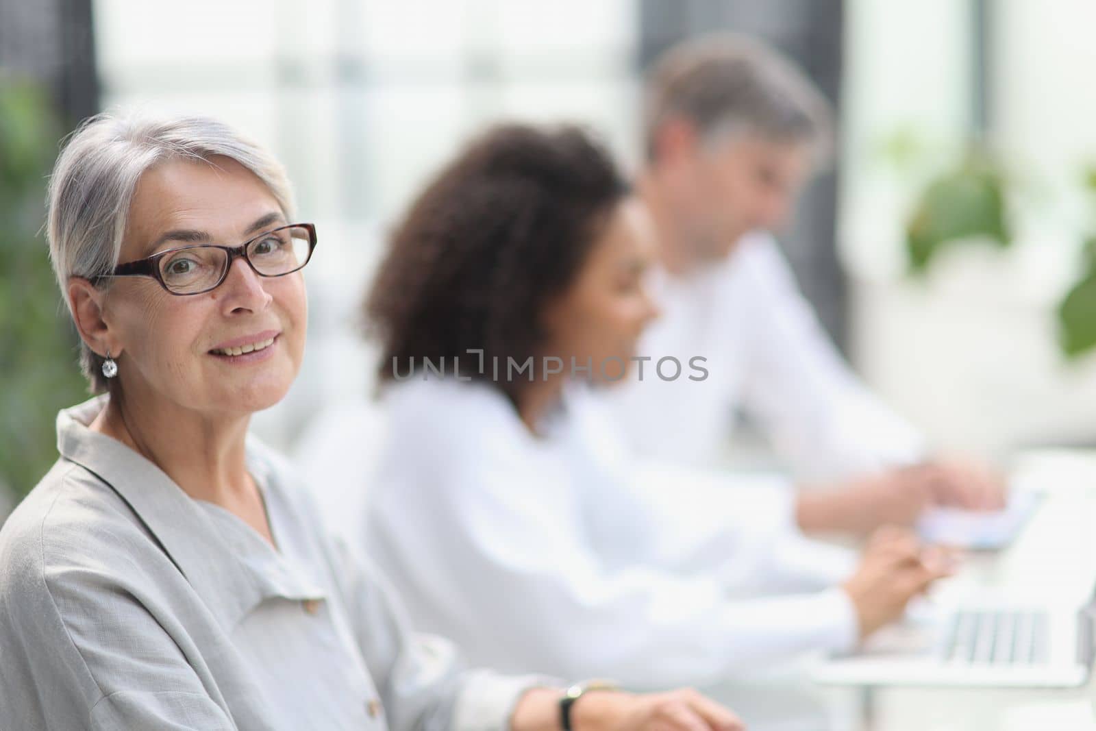 portrait of a mature woman during a break in the office.