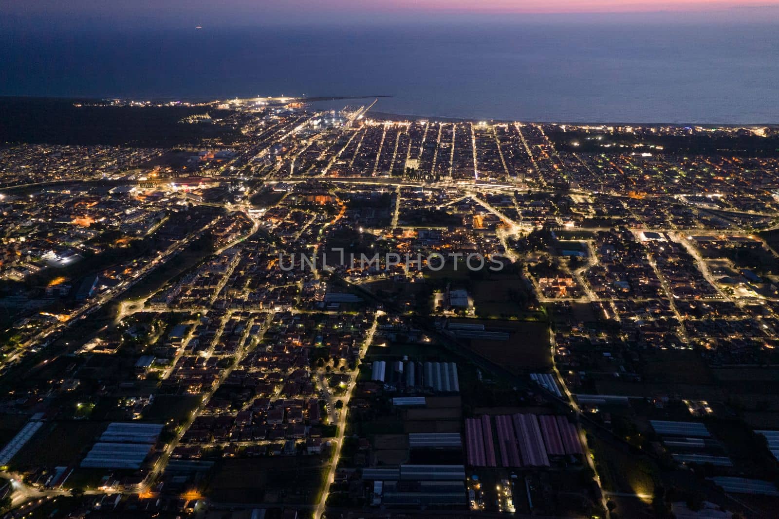 Aerial documentation of the city of Viareggio seen at night 