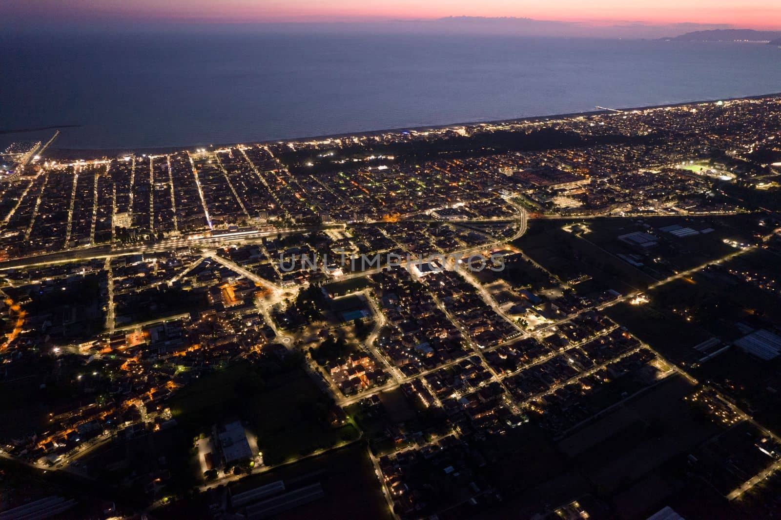 Aerial documentation of the city of Viareggio seen at night 