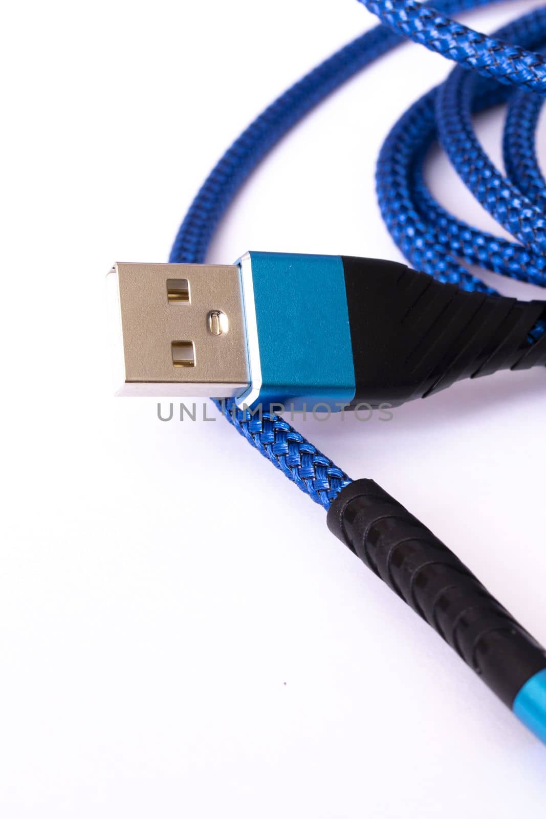 Blue wire to connect the device on white background close up