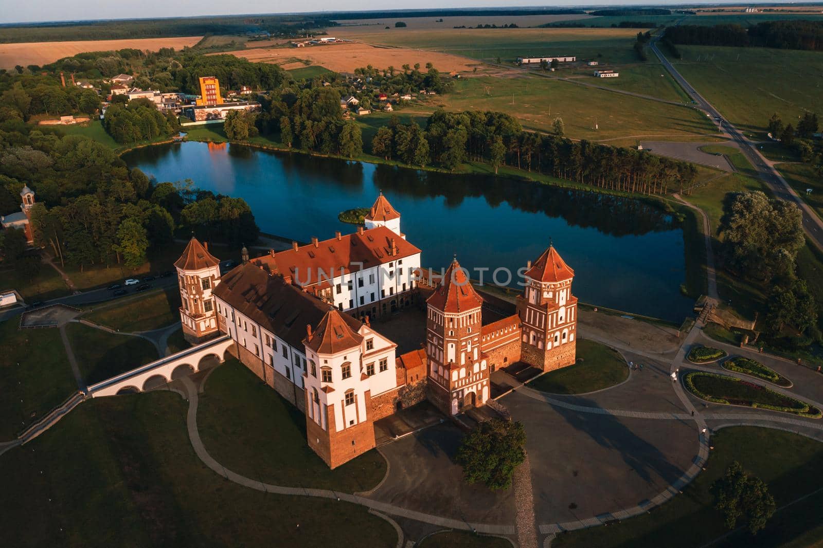 Mir castle with spires near the lake top view in Belarus near the city of Mir by Lobachad