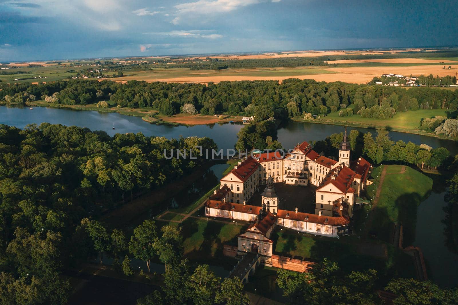 Aerial photo Nesvizh castle in autumn evening, Belarus Minsk, top view. by Lobachad