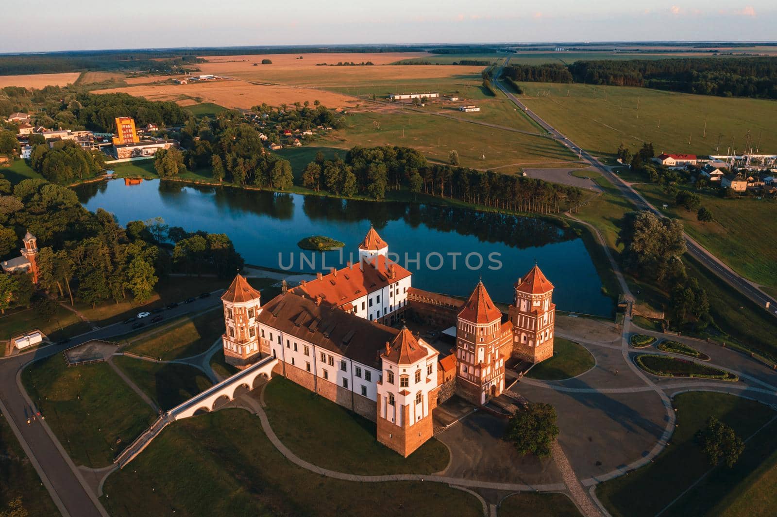 Mir castle with spires near the lake top view in Belarus near the city of Mir by Lobachad