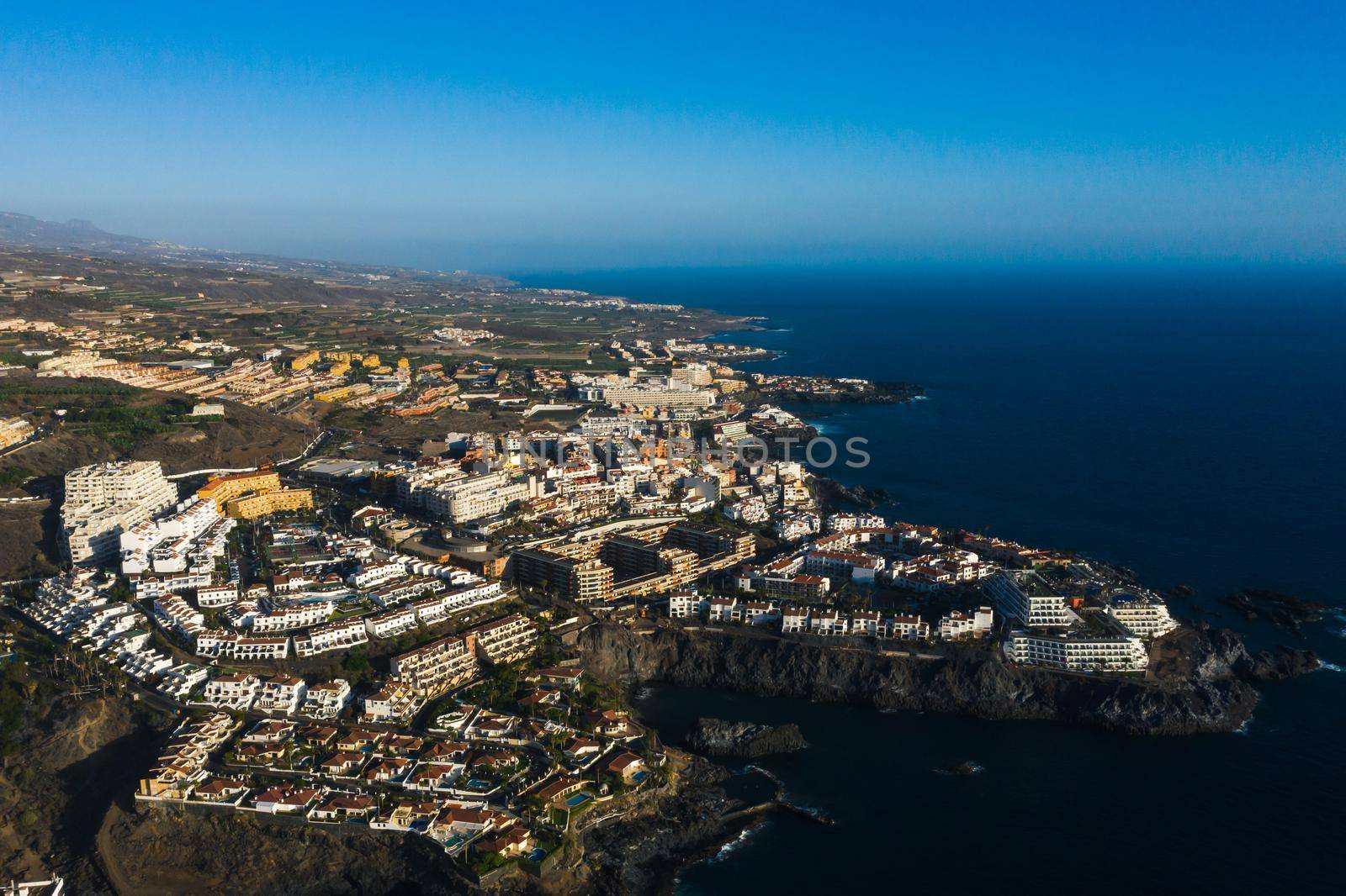 Aerial panorama of Acantilados de Los Gigantes Cliffs of the Giants at sunset, Tenerife, Canary islands, Spain. by Lobachad