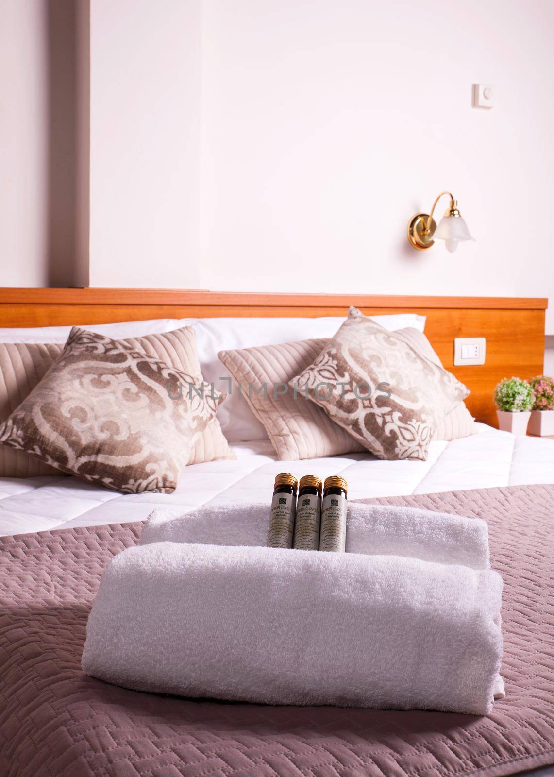 Towels and soap on bed of Ares hotel