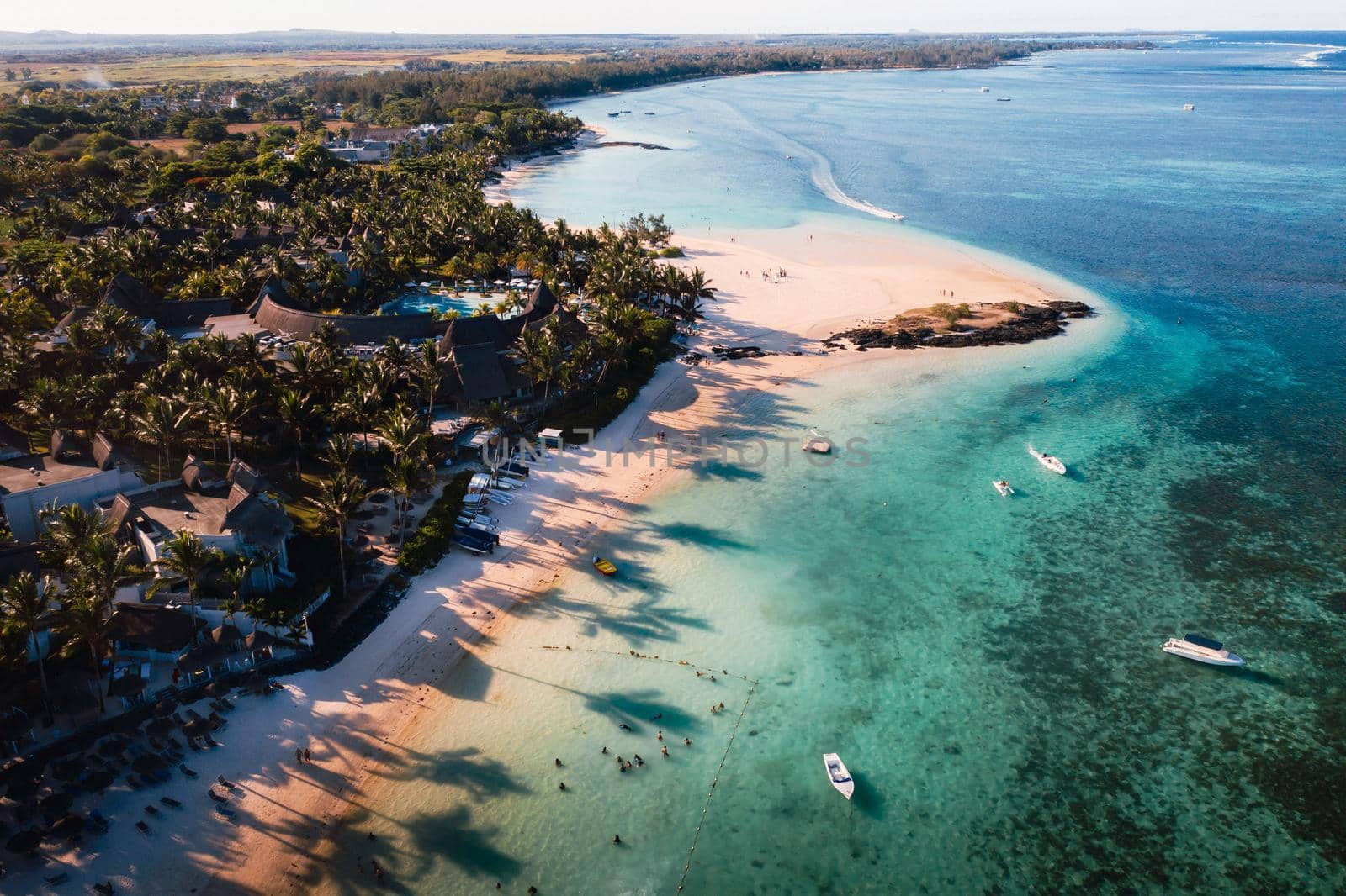 Aerial picture of the east coast of Mauritius Island. Flying above the turquoise lagoon of Mauritius in the region of Belle Mare. by Lobachad