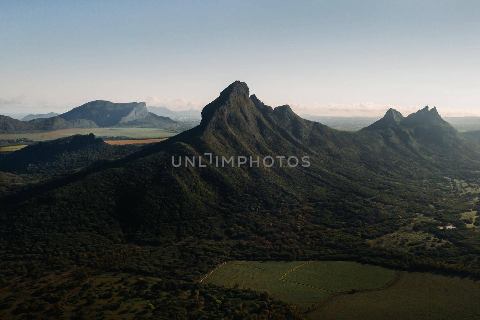 Aerial view of mountains and fields in Mauritius island.