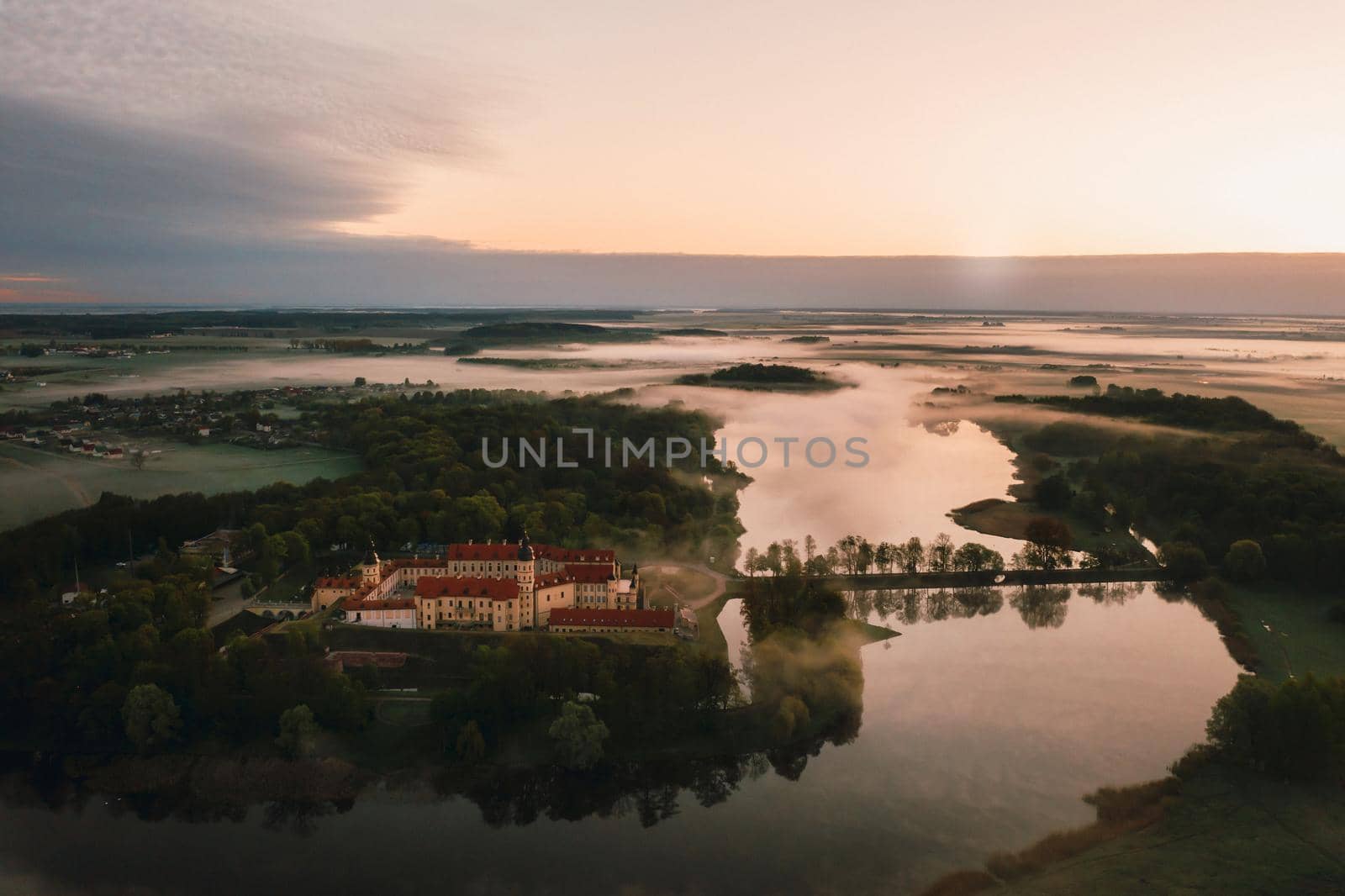 Nesvizh castle is a residential castle of the Radziwill family in Nesvizh, Belarus, with a beautiful view from above at dawn.