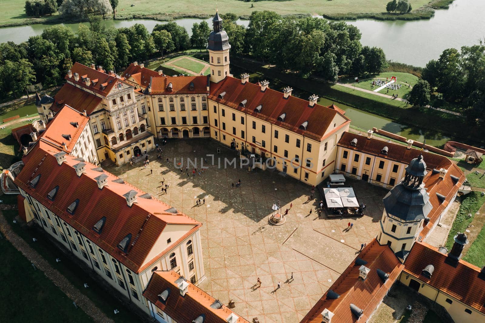 Aerial photo Nesvizh castle in autumn evening, Belarus Minsk, top view.