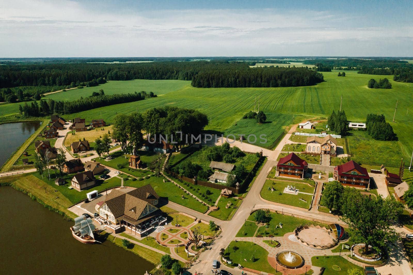 view from the height of the Lake in a green field in the form of a horseshoe and a village in the Mogilev region.Belarus.The Nature Of Belarus by Lobachad