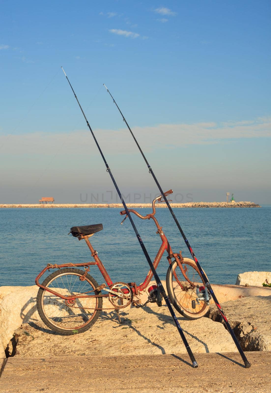 CHIOGGIA, ITALY - JANUARY, 01: Fisher bike with fishing rods on January 01, 2016